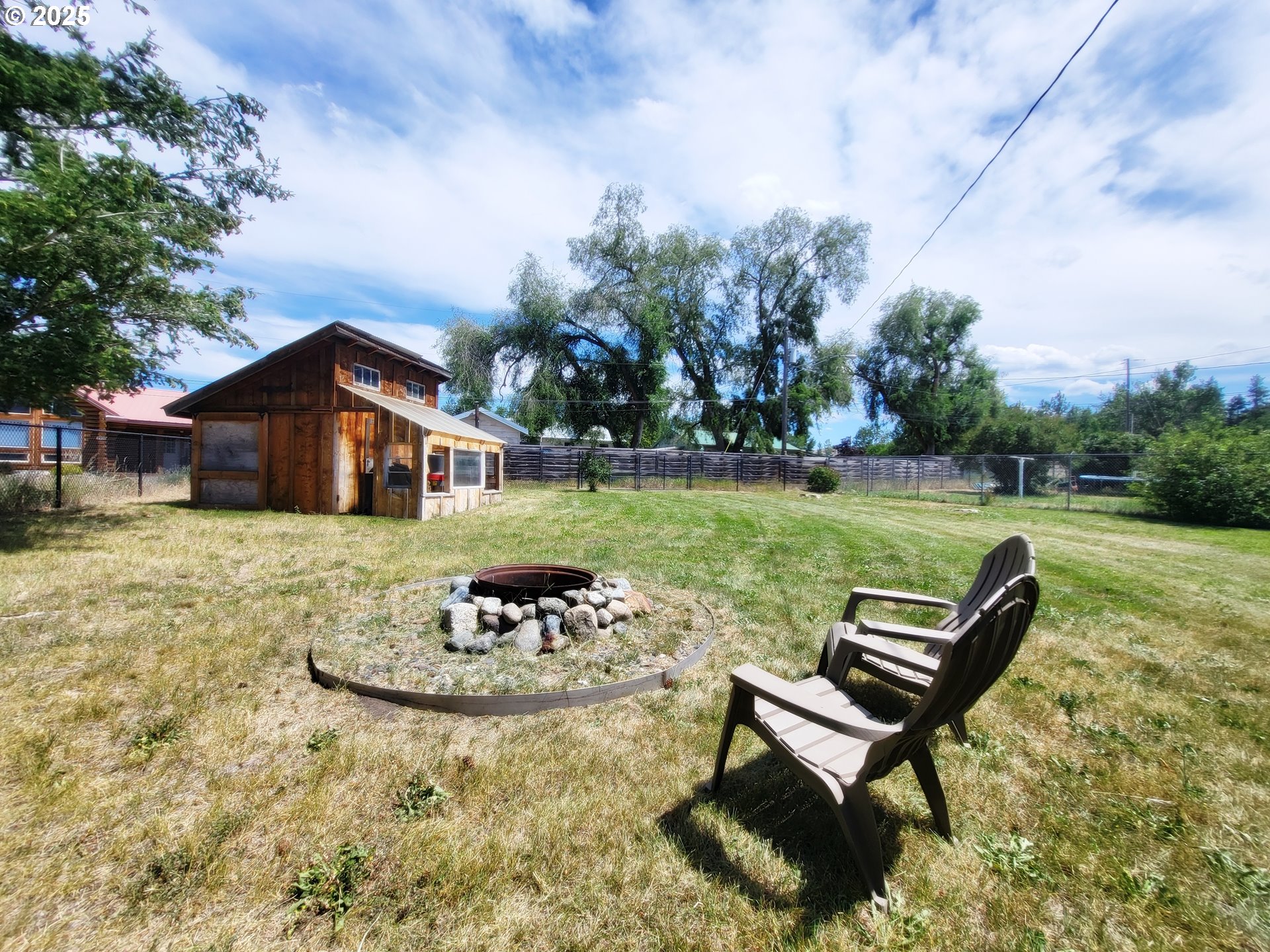 204 North Russell Street Joseph, OR 97846 - Photo 6 of 46 a backyard of a house with table and chairs
