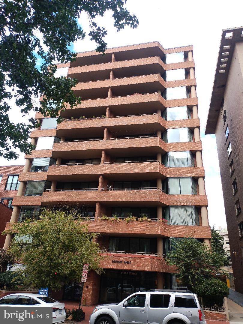2141 P Street Northwest, Unit 202 Washington, DC 20037 - Photo 2 of 30 a front view of a building with a yard