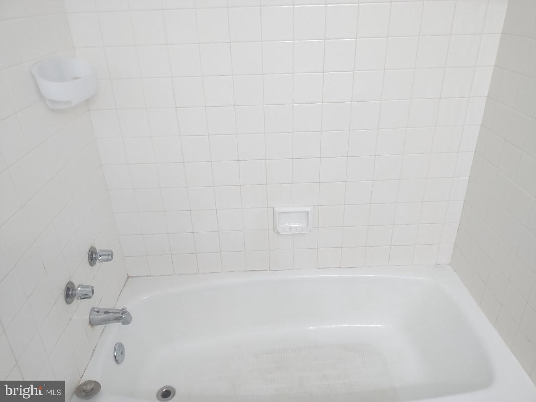 2141 P Street Northwest, Unit 202 Washington, DC 20037 - Photo 22 of 30 a close up of a bathtub