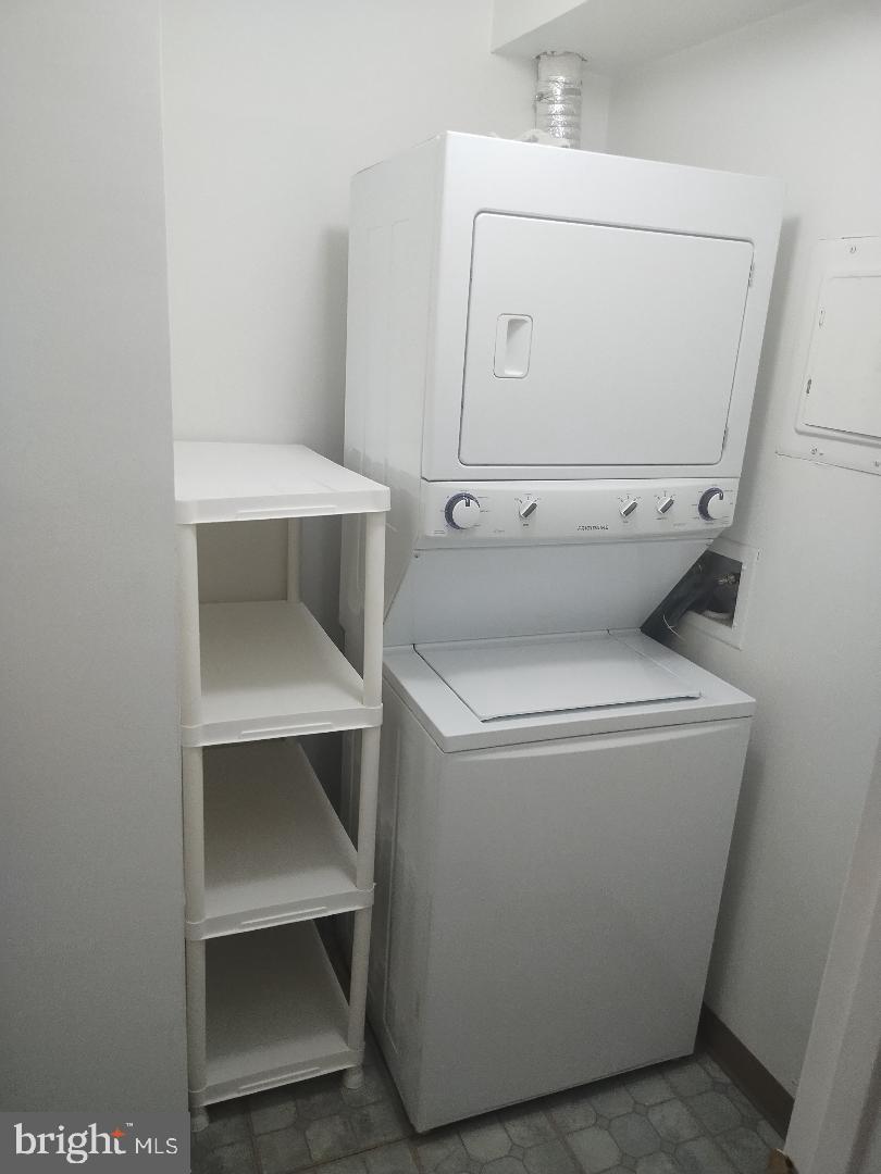 2141 P Street Northwest, Unit 202 Washington, DC 20037 - Photo 24 of 30 a utility room with dryer and washer