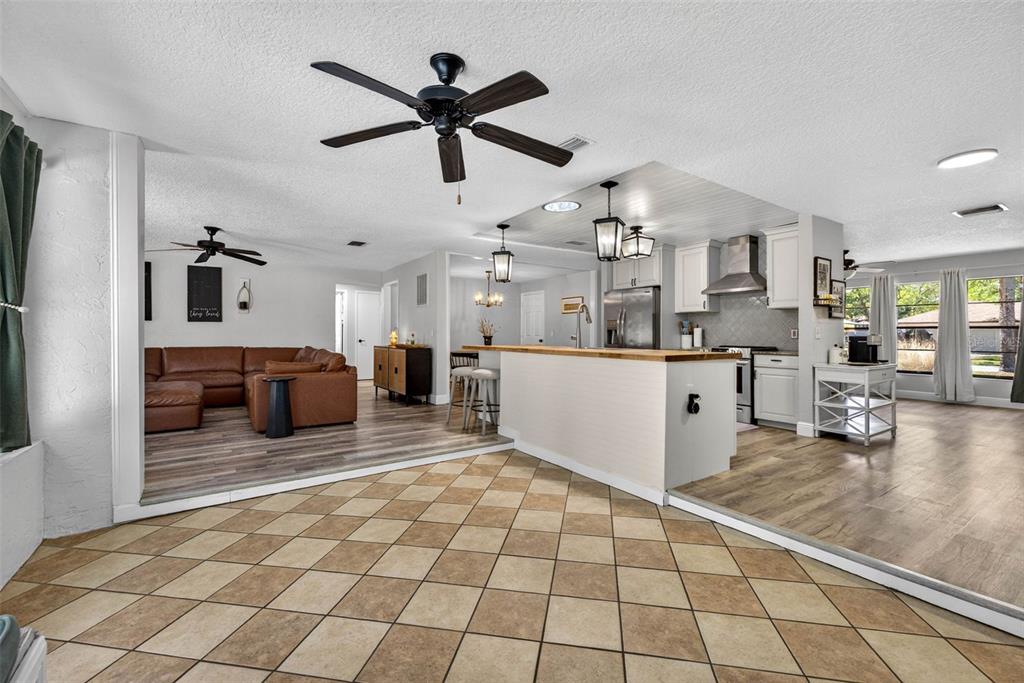 9043 Mc Cormick Street Spring Hill, FL 34608 - Photo 24 of 47 a living room with furniture and kitchen view