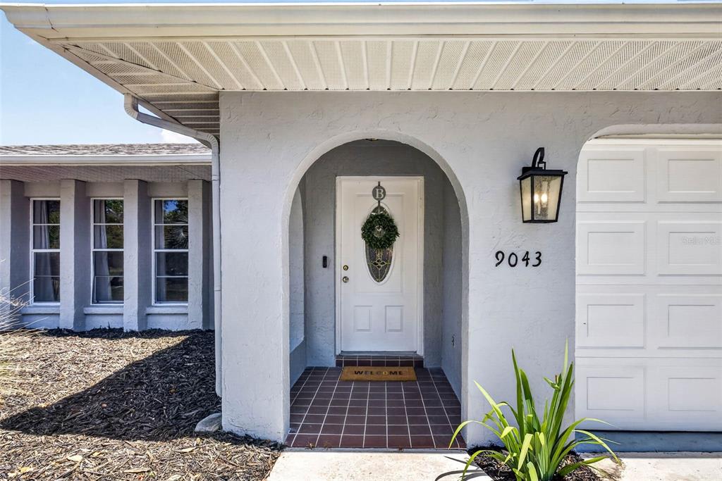 9043 Mc Cormick Street Spring Hill, FL 34608 - Photo 4 of 47 a front view of a house