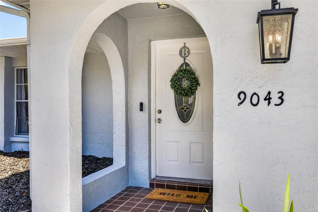 9043 Mc Cormick Street Spring Hill, FL 34608 - Photo 6 of 47 a room with a door and a mirror