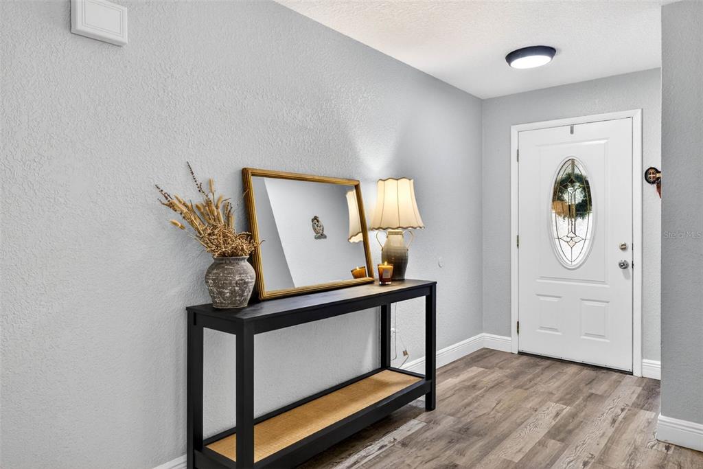 9043 Mc Cormick Street Spring Hill, FL 34608 - Photo 7 of 47 a view of a hallway with elevator