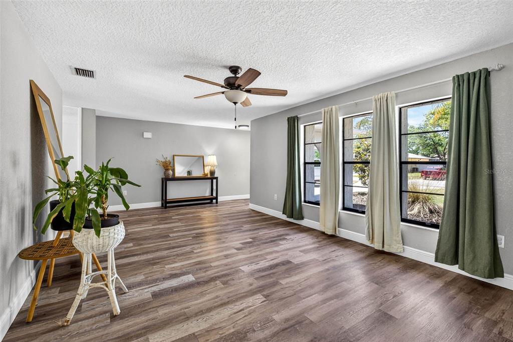 9043 Mc Cormick Street Spring Hill, FL 34608 - Photo 10 of 47 a room with furniture and a potted plant