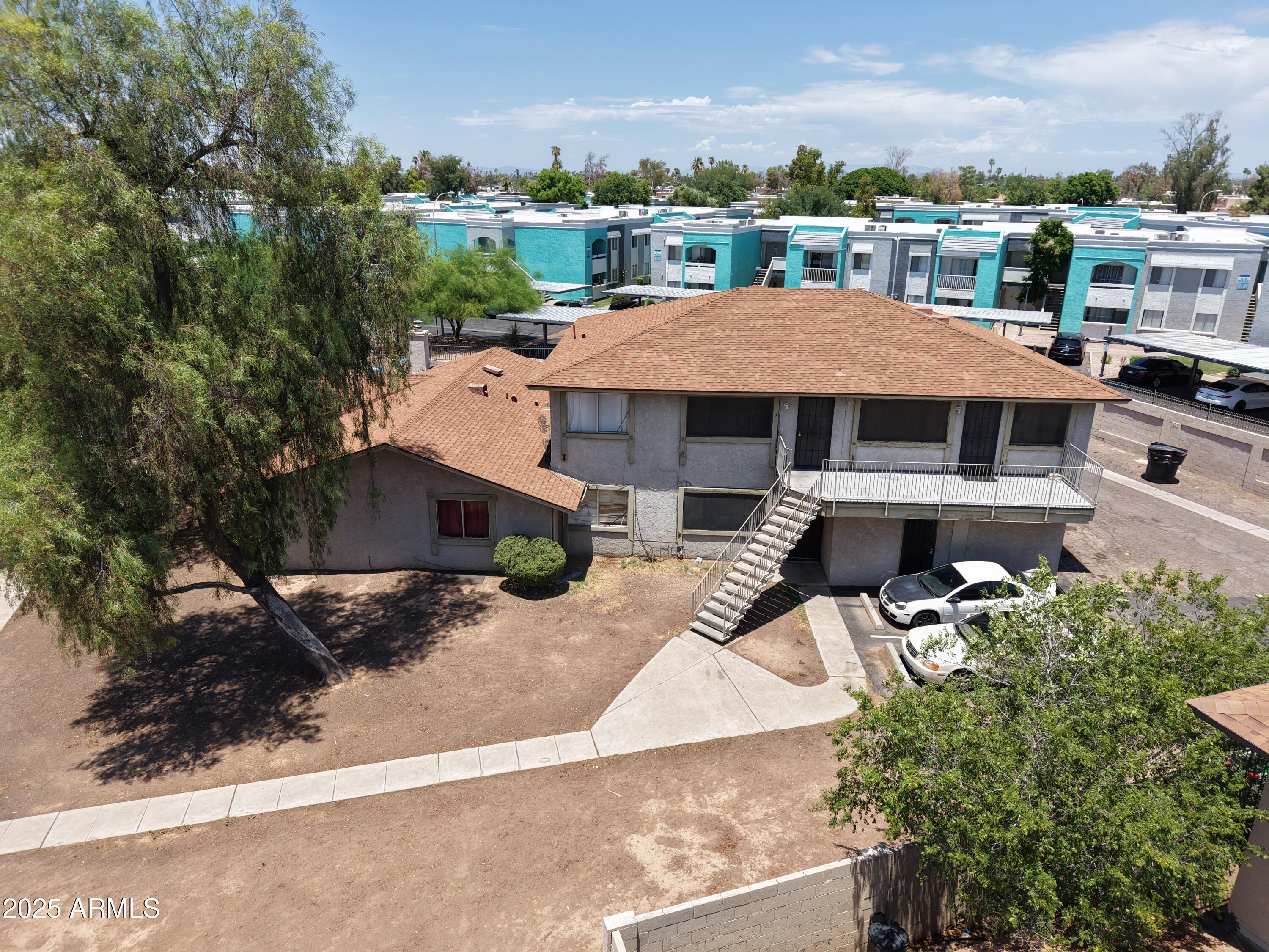 3364 West Harmont Drive Phoenix, AZ 85051 - Photo 1 of 39 an aerial view of a house with a yard