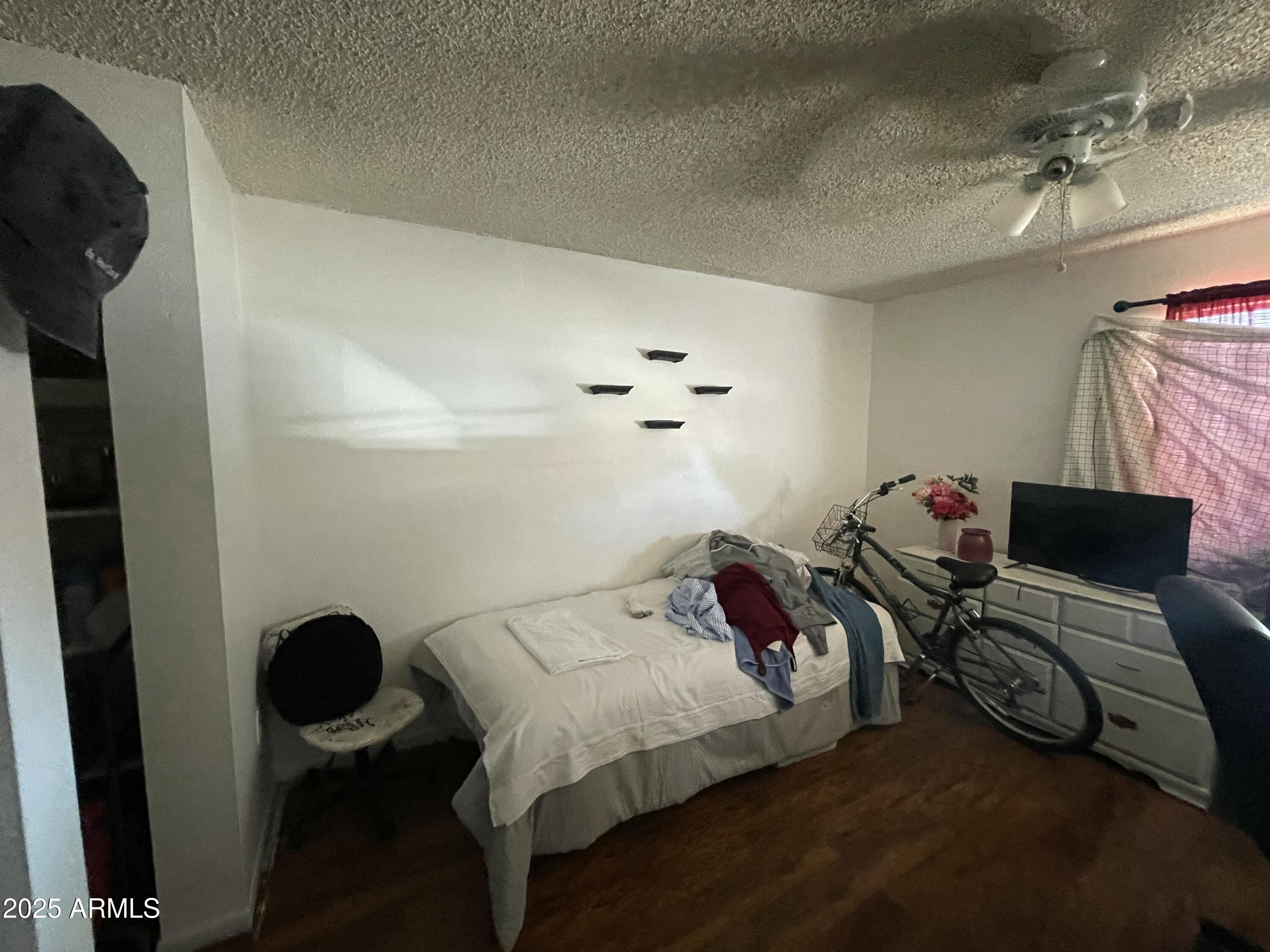 3364 West Harmont Drive Phoenix, AZ 85051 - Photo 13 of 39 a bedroom with a bed and furniture