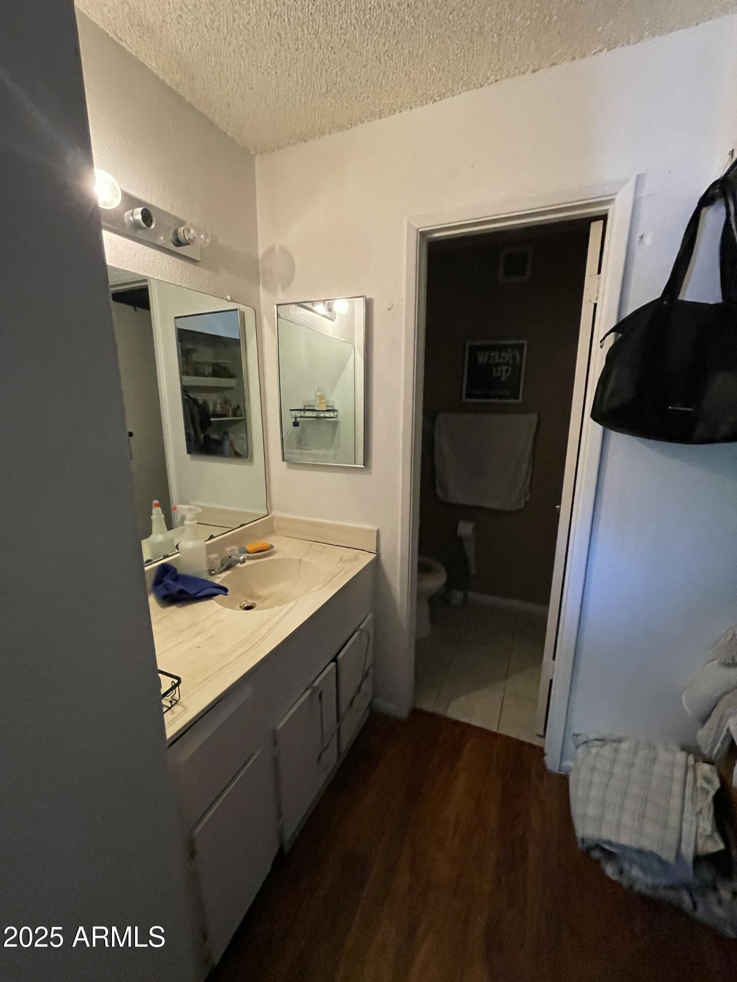3364 West Harmont Drive Phoenix, AZ 85051 - Photo 14 of 39 a bathroom with a sink double vanity granite tub shower and mirror