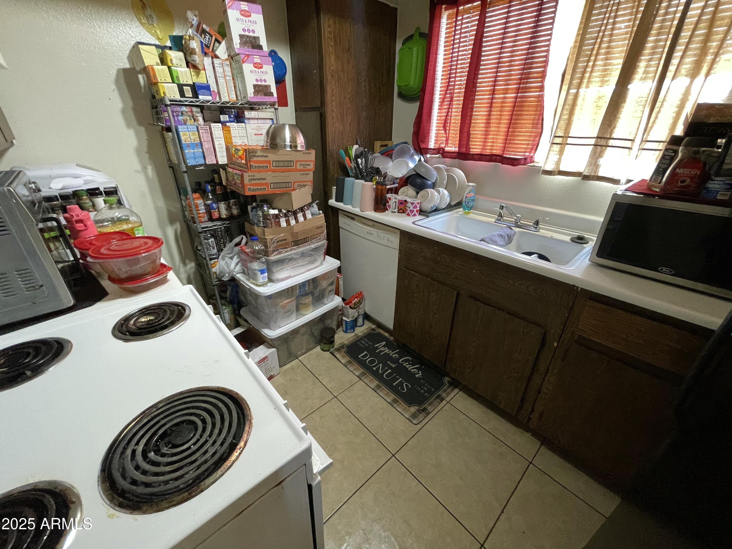 3364 West Harmont Drive Phoenix, AZ 85051 - Photo 36 of 39 a bathroom with a sink and a washing machine