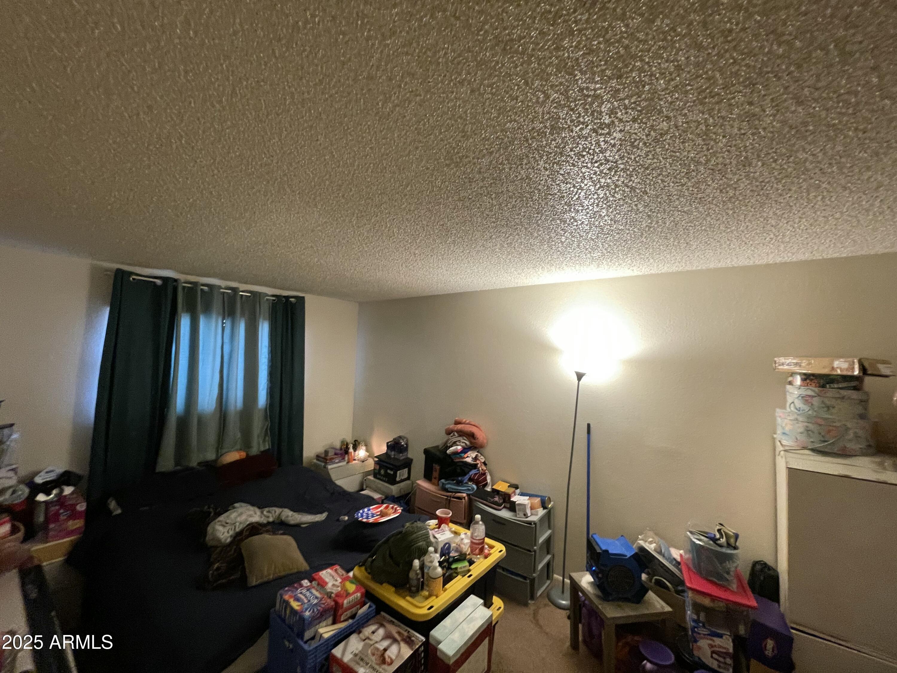 3364 West Harmont Drive Phoenix, AZ 85051 - Photo 39 of 39 a room with furniture and gym equipment