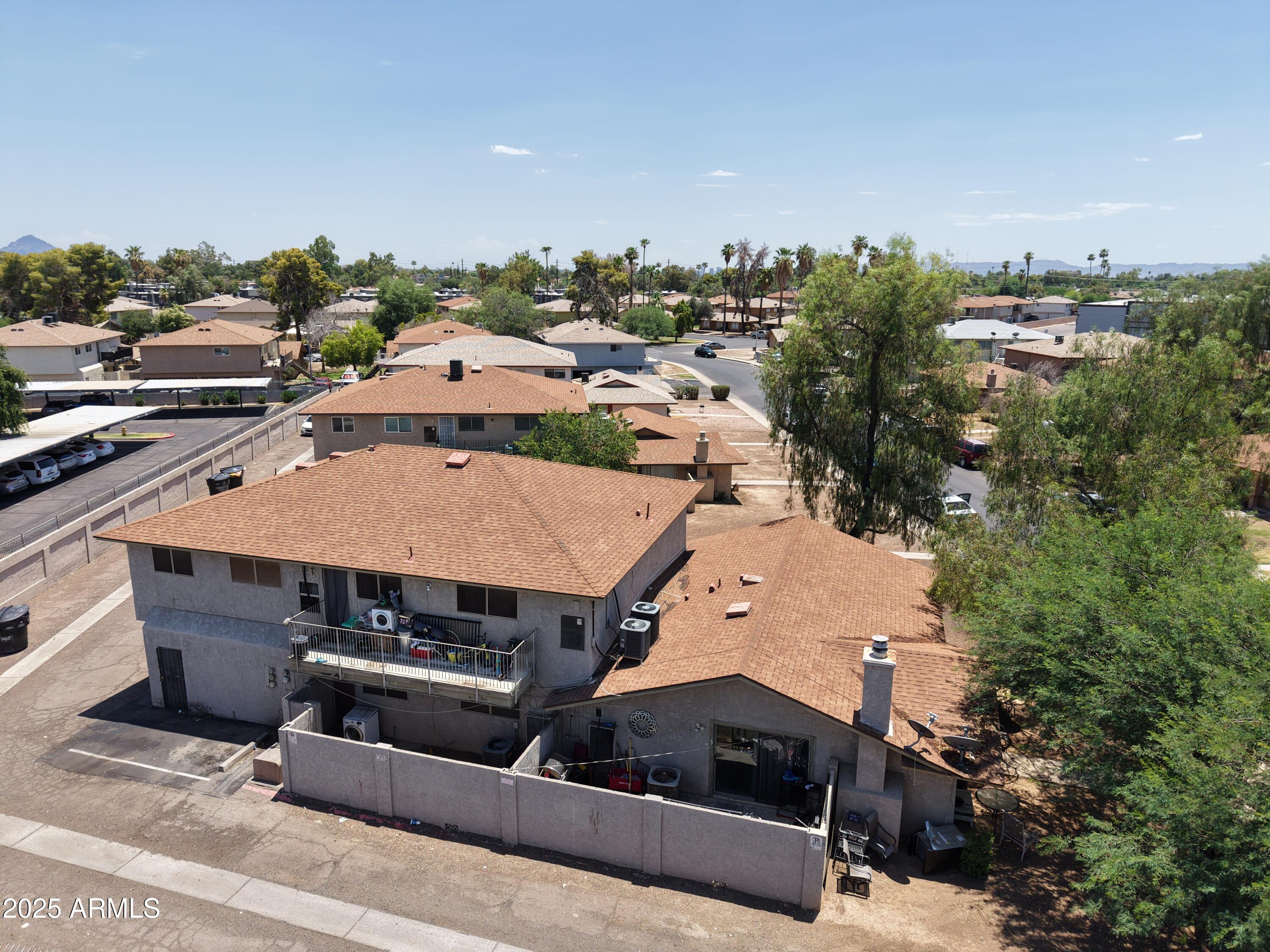 3364 West Harmont Drive Phoenix, AZ 85051 - Photo 4 of 39 an aerial view of a house with a garden