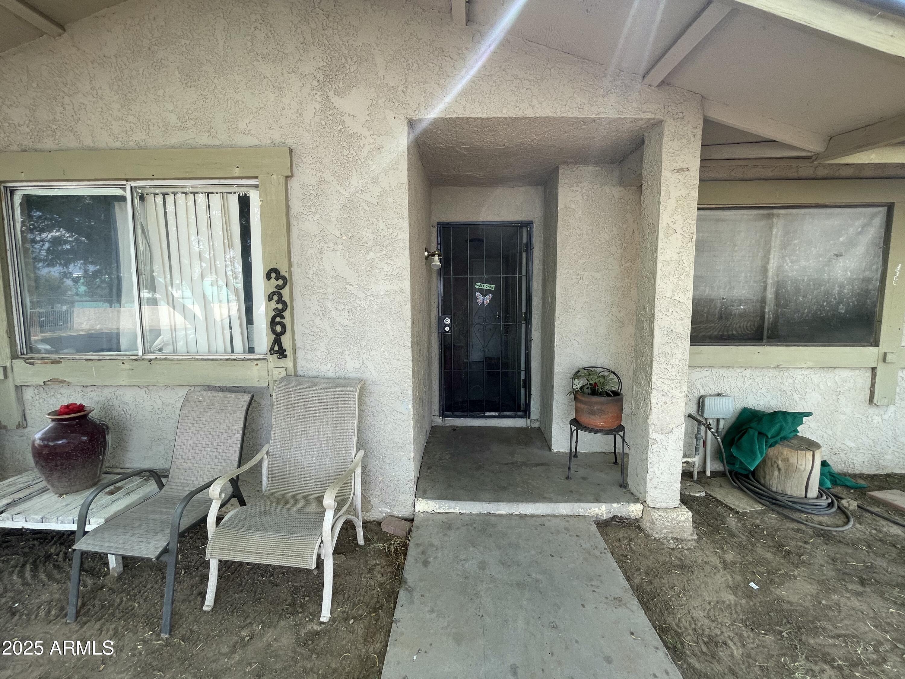 3364 West Harmont Drive Phoenix, AZ 85051 - Photo 6 of 39 a living room with furniture and a window
