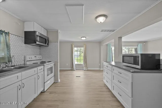 a large kitchen with cabinets
