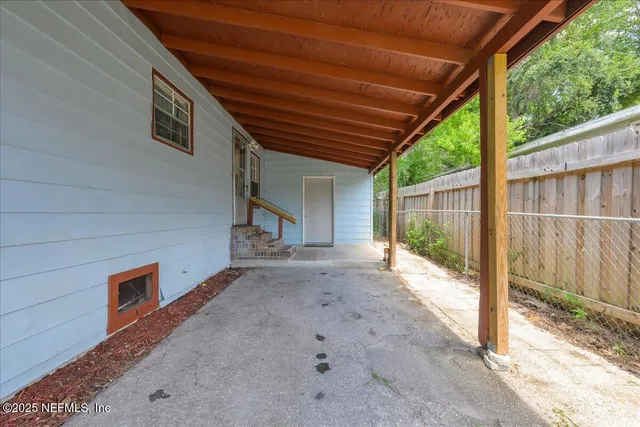 a view of a garden with a tree in the background