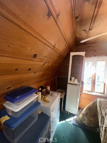 a view of an empty room with a fireplace