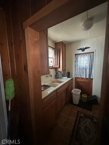 a living room with lots of furniture and chandelier