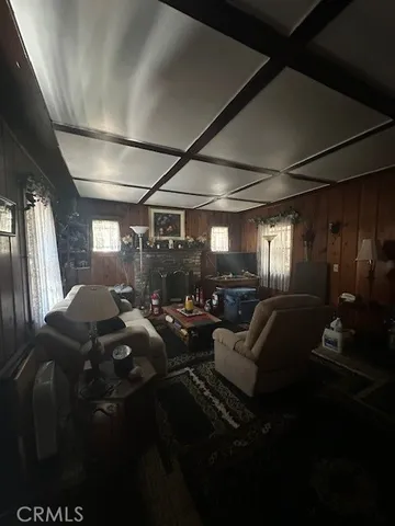 a living room with furniture a lamp and a window