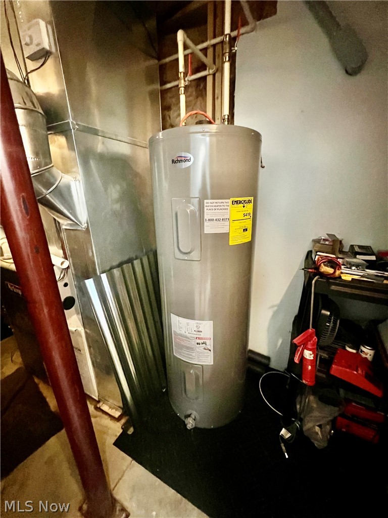 39589 National Road Bethesda, OH 43719 - Photo 22 of 35 Utility room featuring water heater