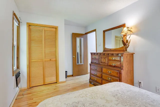 a bedroom with a bed and furniture