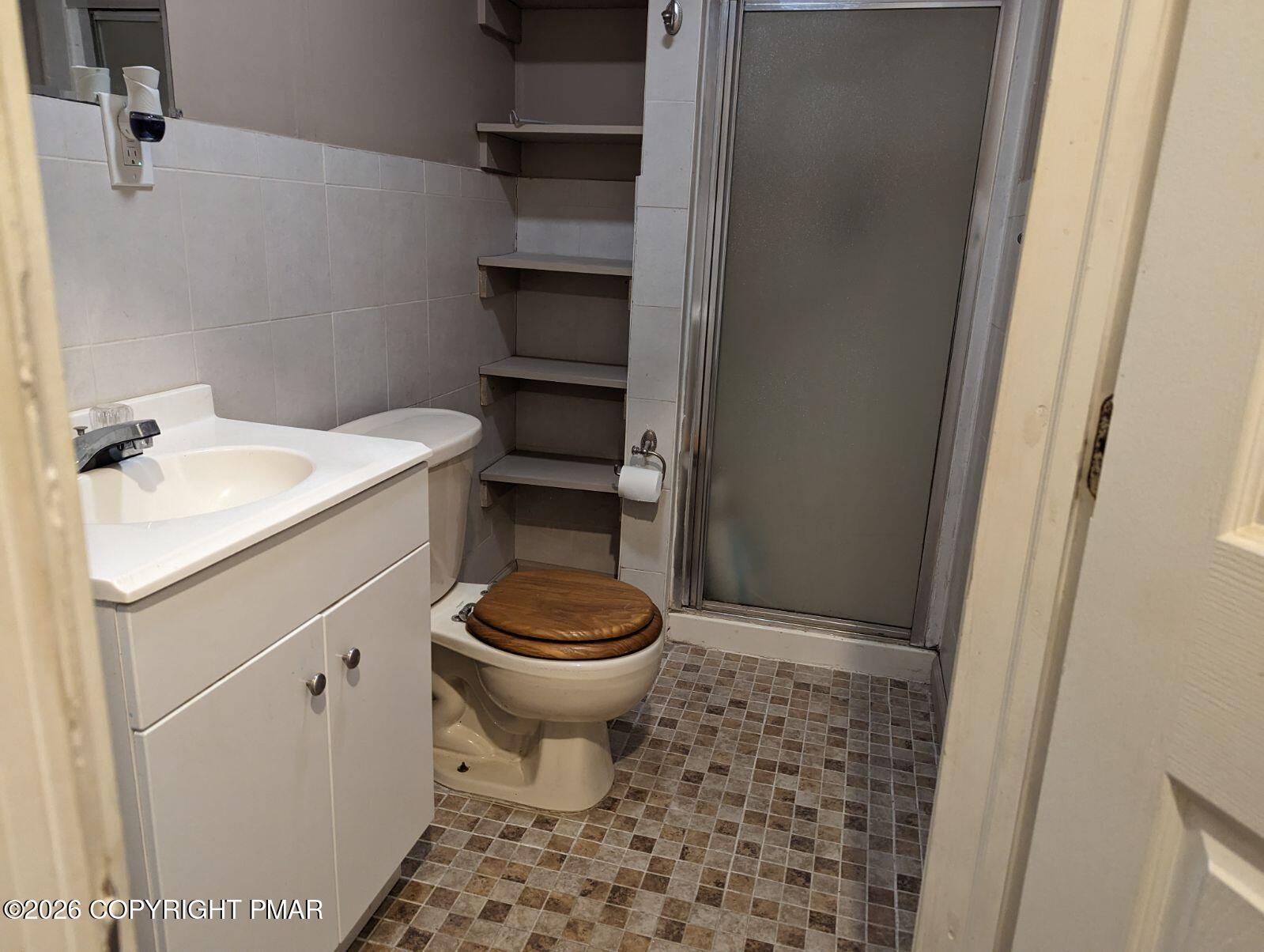 116 Eton Court Bushkill, PA 18324 - Photo 4 of 7 a bathroom with a toilet and a sink