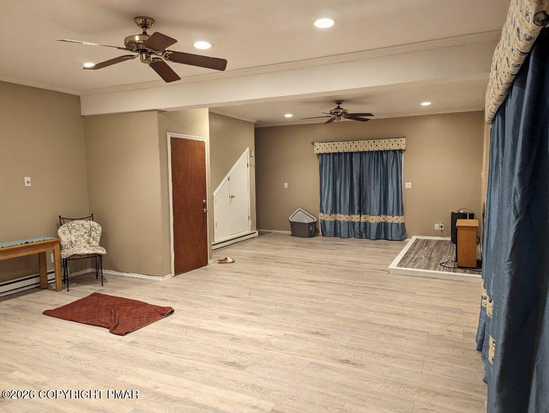 116 Eton Court Bushkill, PA 18324 - Photo 5 of 7 a bedroom with a bed chandelier and a view of kitchen