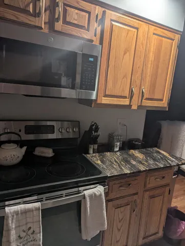 a kitchen with a cabinets and appliances