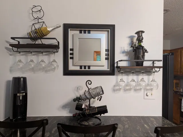 a view of dining room with wooden floor and cabinet