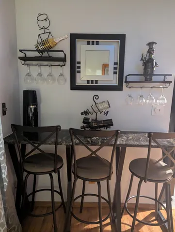 a dining room with furniture and window