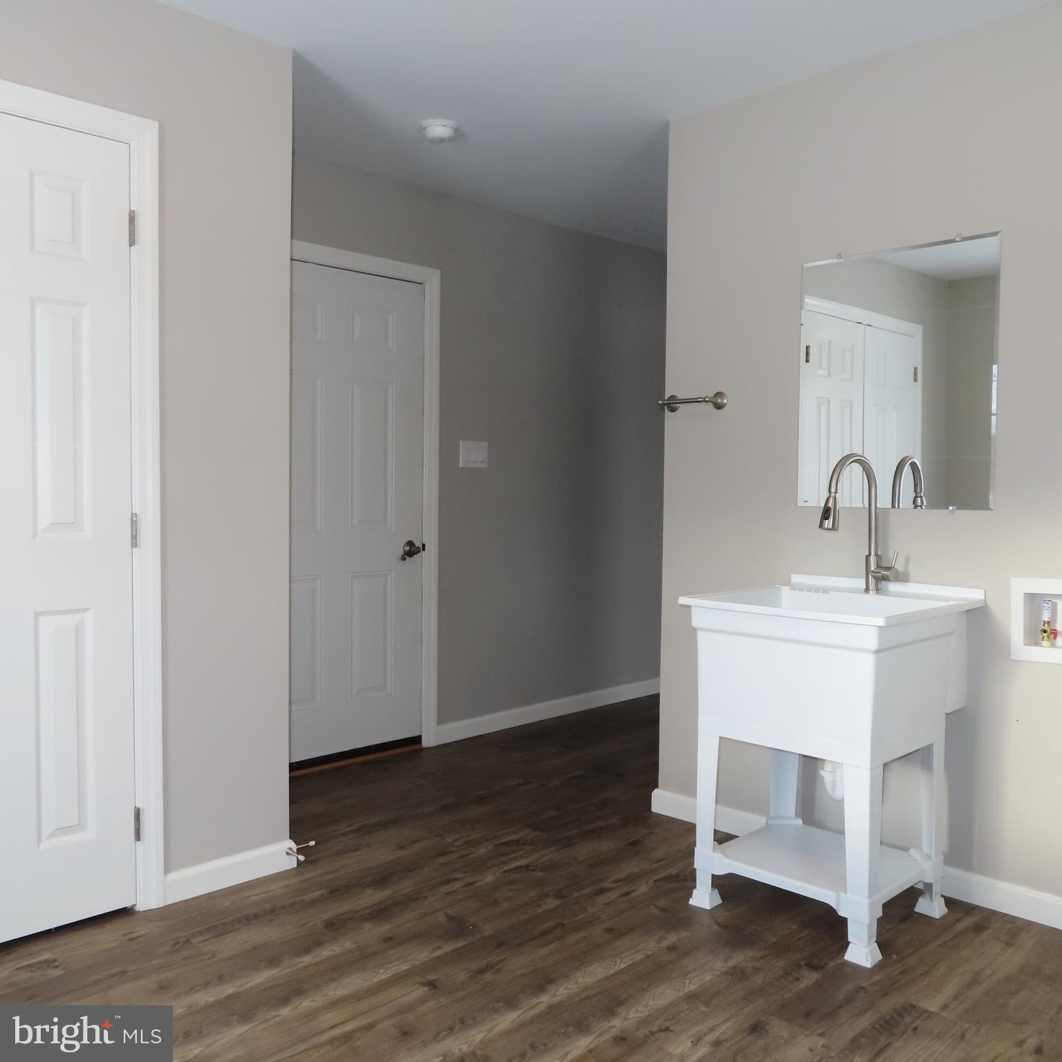 5237 Rolling Road, Unit H Chambersburg, PA 17202 - Photo 11 of 36 a room with a sink and a mirror