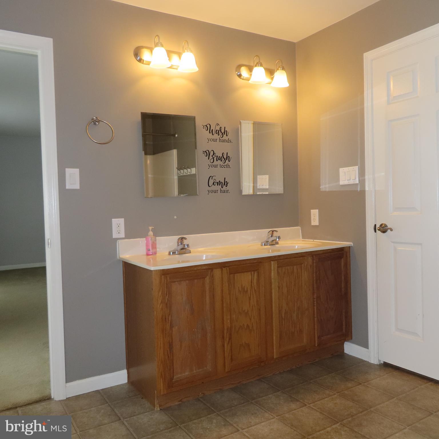 5237 Rolling Road, Unit H Chambersburg, PA 17202 - Photo 21 of 36 a bathroom with a sink and mirror