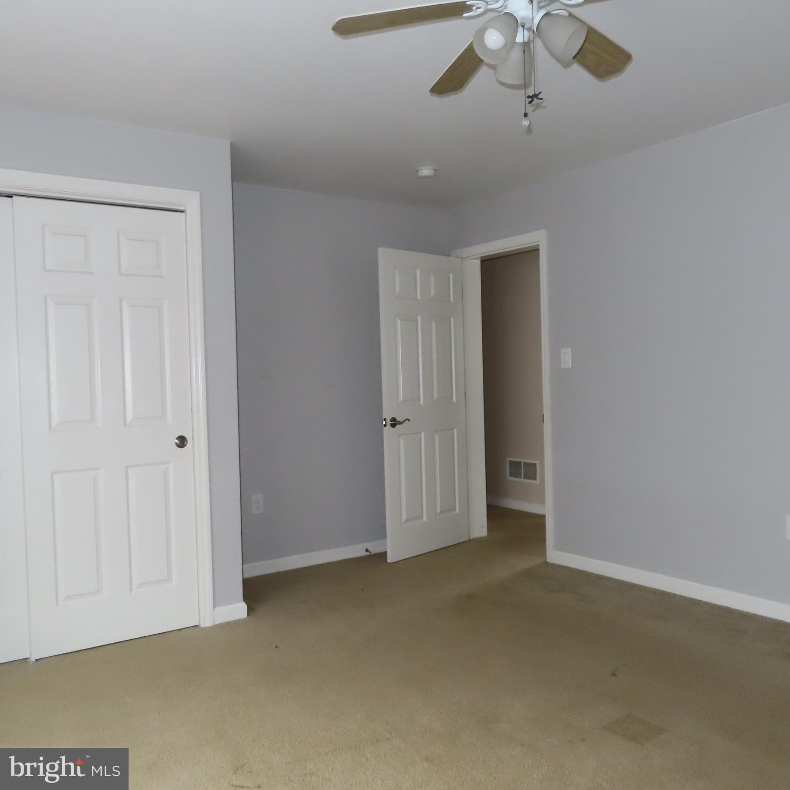 5237 Rolling Road, Unit H Chambersburg, PA 17202 - Photo 27 of 36 an empty room with a ceiling fan