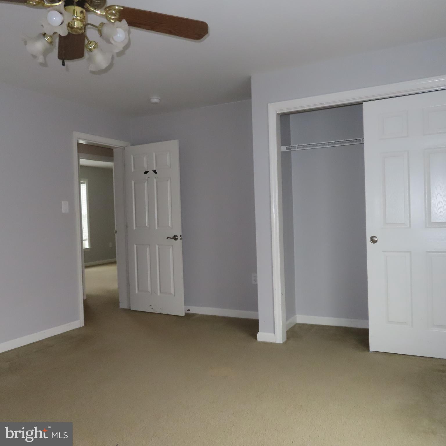 5237 Rolling Road, Unit H Chambersburg, PA 17202 - Photo 30 of 36 an empty room with a chandelier fan