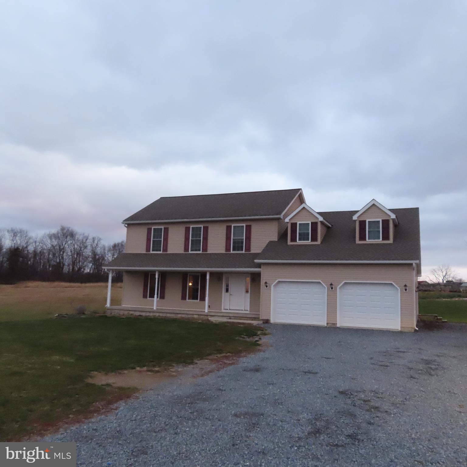 5237 Rolling Road, Unit H Chambersburg, PA 17202 - Photo 36 of 36 a front view of a house with a yard and garage