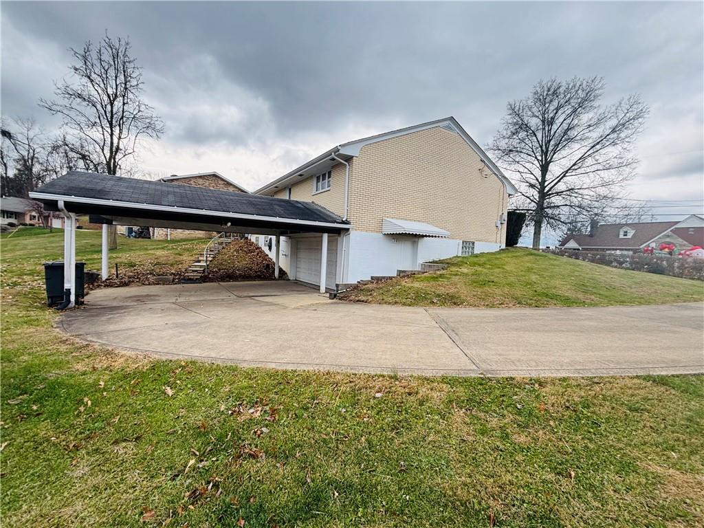 156 Terrace Drive Monongahela, PA 15063 - Photo 5 of 24 a front view of a house with a yard and garage