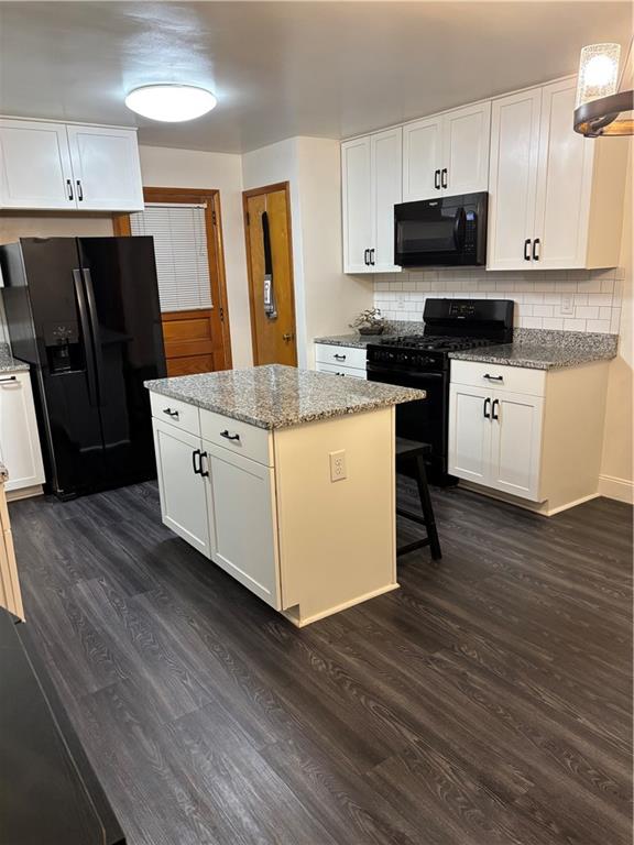 156 Terrace Drive Monongahela, PA 15063 - Photo 7 of 24 a kitchen with stainless steel appliances granite countertop a stove a sink and a refrigerator