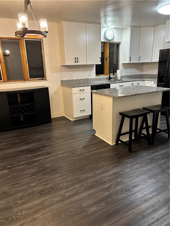 156 Terrace Drive Monongahela, PA 15063 - Photo 8 of 24 a kitchen with stainless steel appliances a stove top oven a sink cabinets and a wooden floor