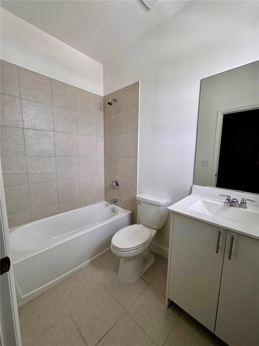 15538 Southwest 276th Terrace Homestead, FL 33032 - Photo 16 of 16 a bathroom with a sink a toilet and shower