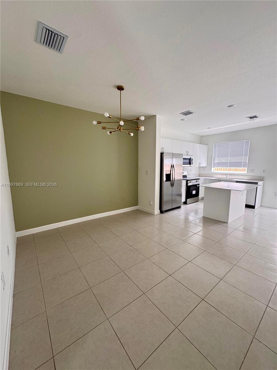 15538 Southwest 276th Terrace Homestead, FL 33032 - Photo 7 of 16 a view of a kitchen with a sink