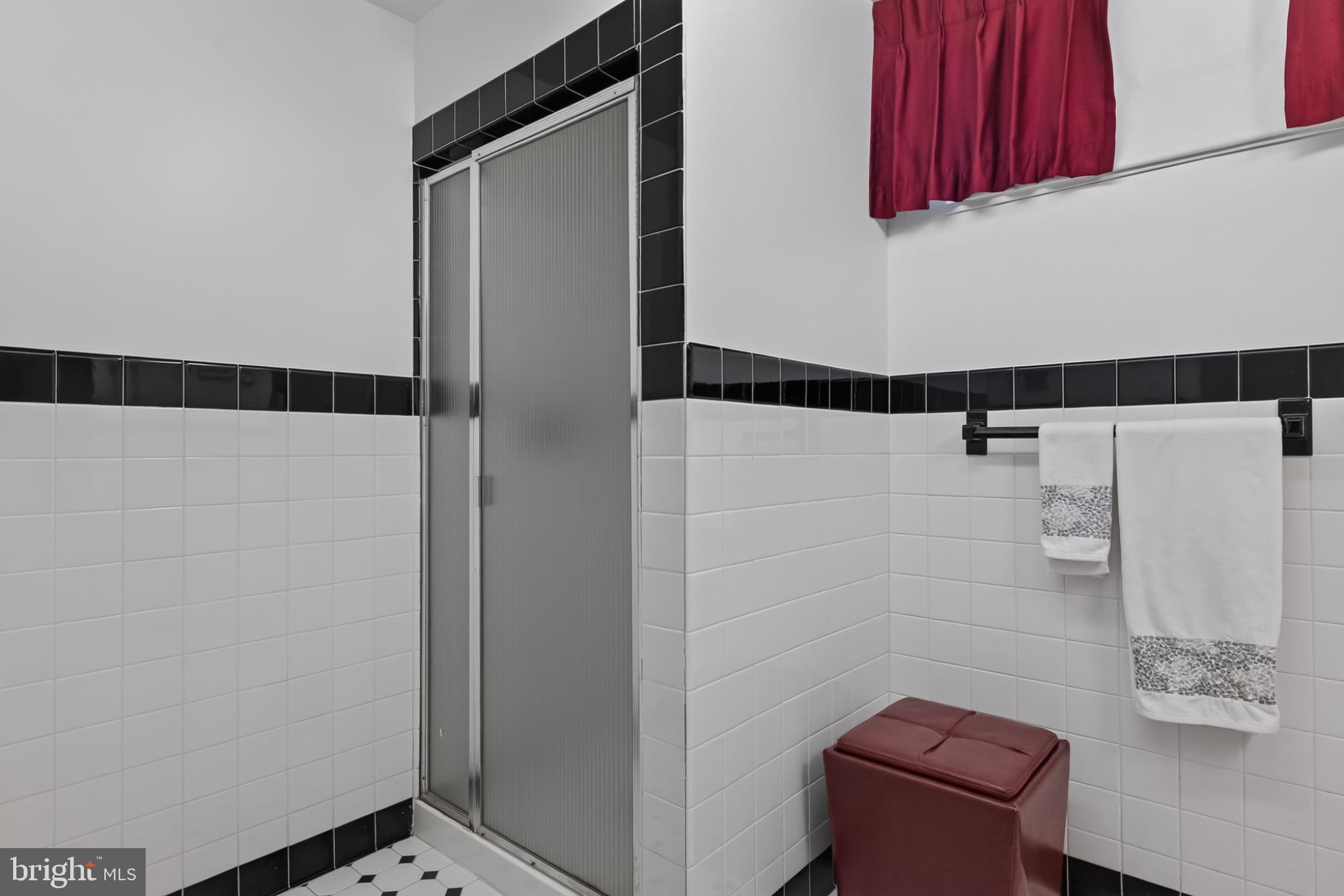 4212 Dustin Road Burtonsville, MD 20866 - Photo 48 of 65 Sleek black and white bathroom retreat.