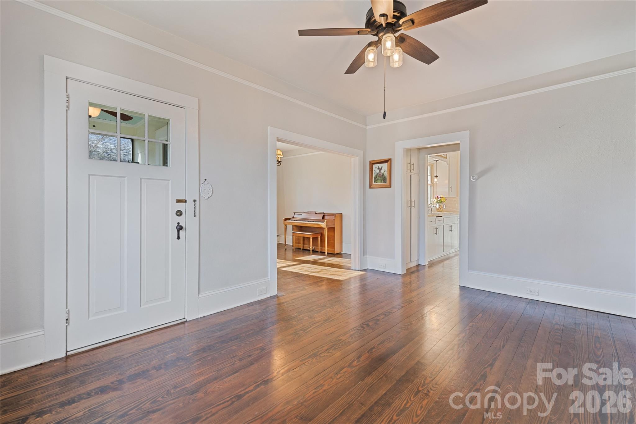 57 Fiddle Drive Canton, NC 28716 - Photo 11 of 35 a view of an empty room with window and wooden floor