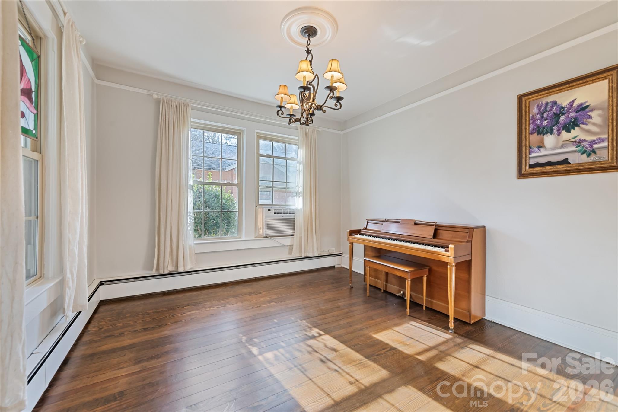 57 Fiddle Drive Canton, NC 28716 - Photo 13 of 35 a living room with a piano and a window