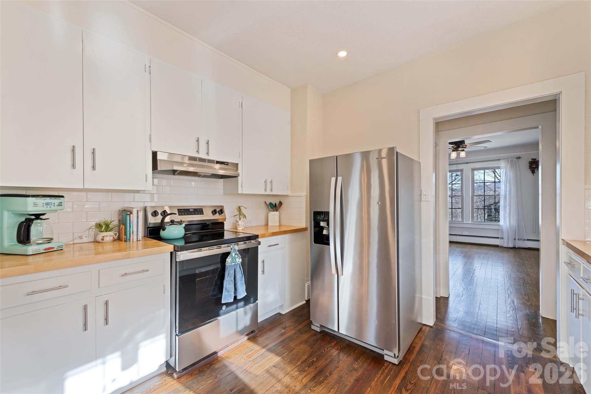 57 Fiddle Drive Canton, NC 28716 - Photo 17 of 35 a kitchen with stainless steel appliances a refrigerator sink and cabinets