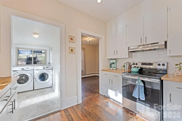 a view of kitchen with sink and wooden floor