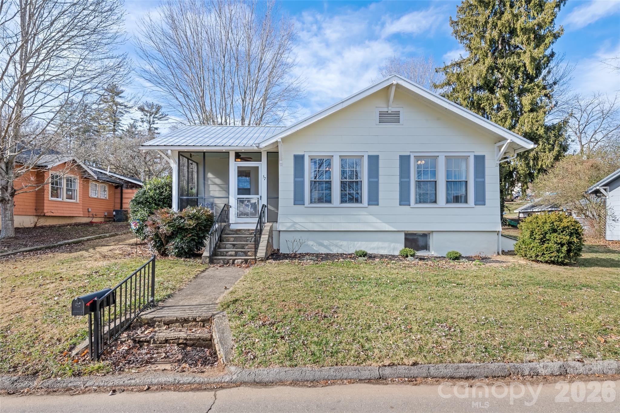 57 Fiddle Drive Canton, NC 28716 - Photo 2 of 35 a front view of a house with garden