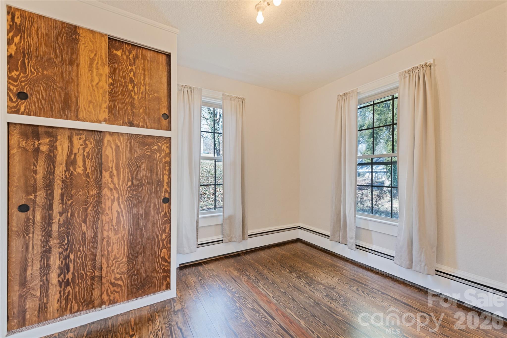 57 Fiddle Drive Canton, NC 28716 - Photo 23 of 35 wooden floor in an empty room with a window