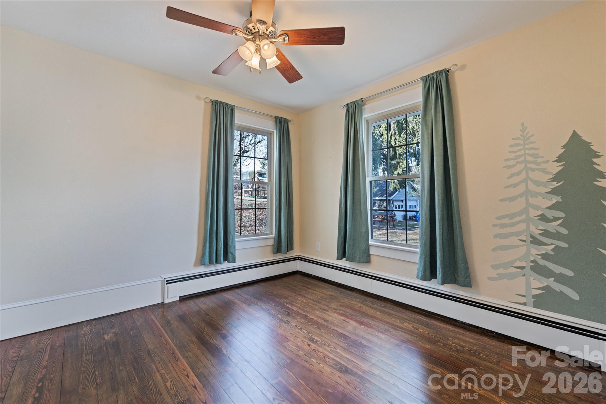 57 Fiddle Drive Canton, NC 28716 - Photo 26 of 35 wooden floor in an empty room with a window