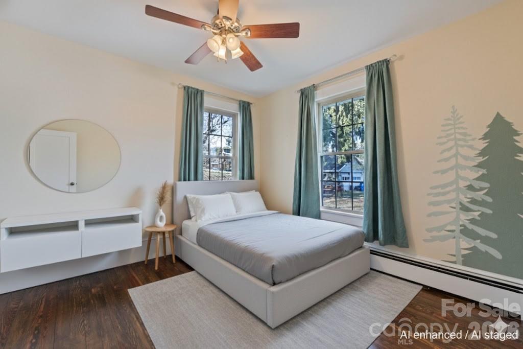 57 Fiddle Drive Canton, NC 28716 - Photo 27 of 35 a bedroom with a large bed and a window