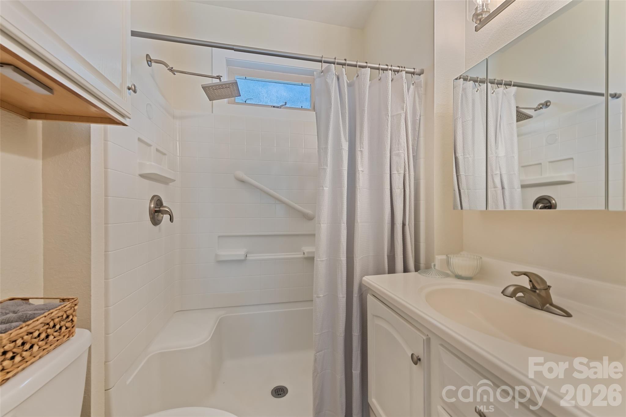 57 Fiddle Drive Canton, NC 28716 - Photo 29 of 35 a bathroom with a sink double vanity and shower