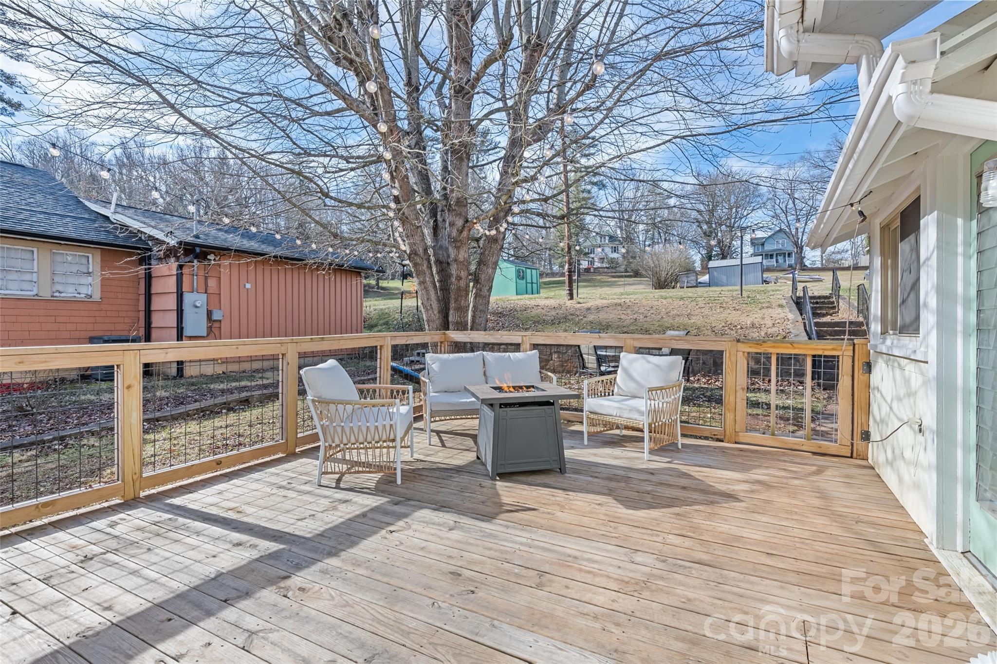57 Fiddle Drive Canton, NC 28716 - Photo 5 of 35 a view of a patio with table and chairs and wooden floor