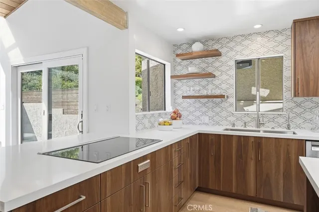 a kitchen with a sink and large window